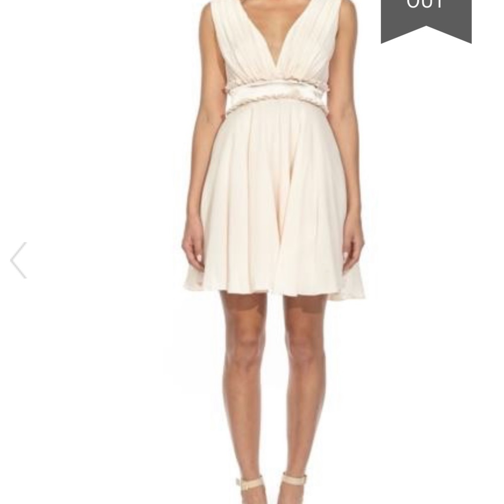 Nude mini dress with ruffle waist